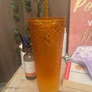 Orange Starbucks cup
